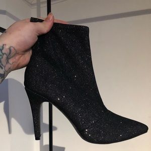 Black sparkling high heels boots